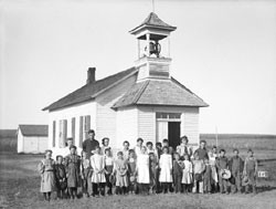 250x189 shot of children outside of prairie school, clothing from 1800's