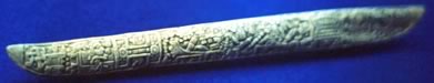 391x75 pixel image of carved MesoAmerican bone