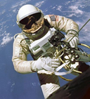 astronaut on spacewalk holding set of tools